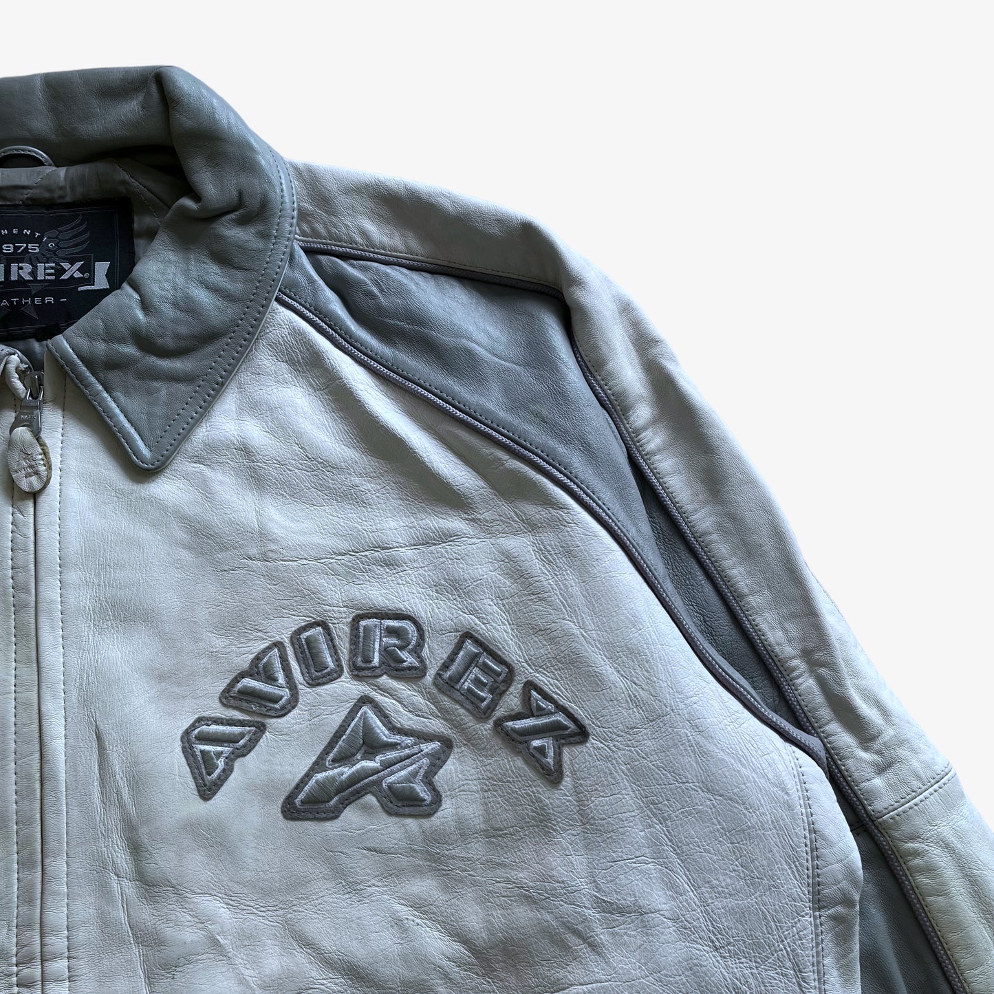 Vintage 90s Mens AVIREX White & Grey Leather Varsity Jacket With Back Embroidered Spell Out Crest - Casspios Dream